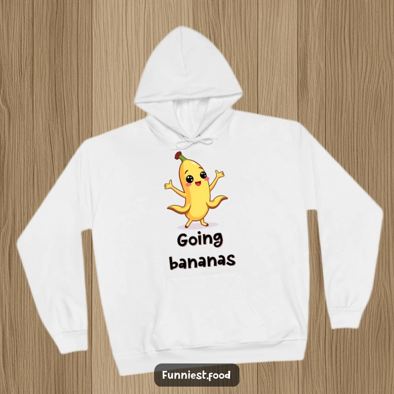 Funny banana character dancing with peel legs outstretched on a cozy hoodie, perfect for warmth and laughs.
